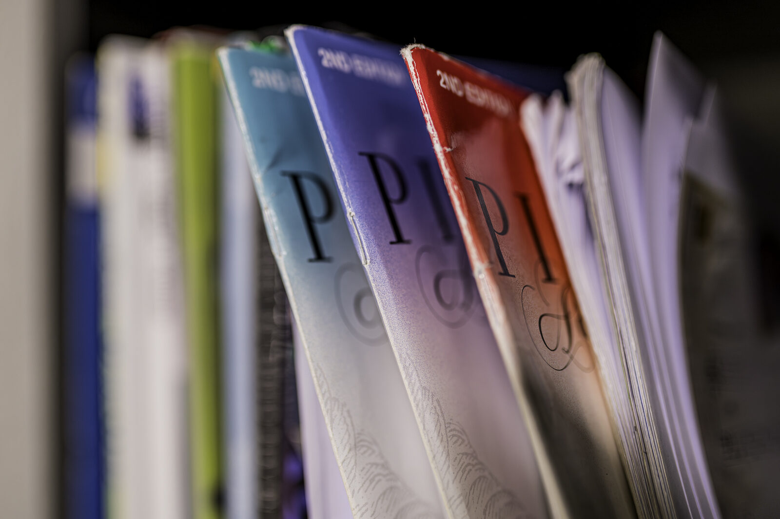 Piano method books on a shelf at the studio